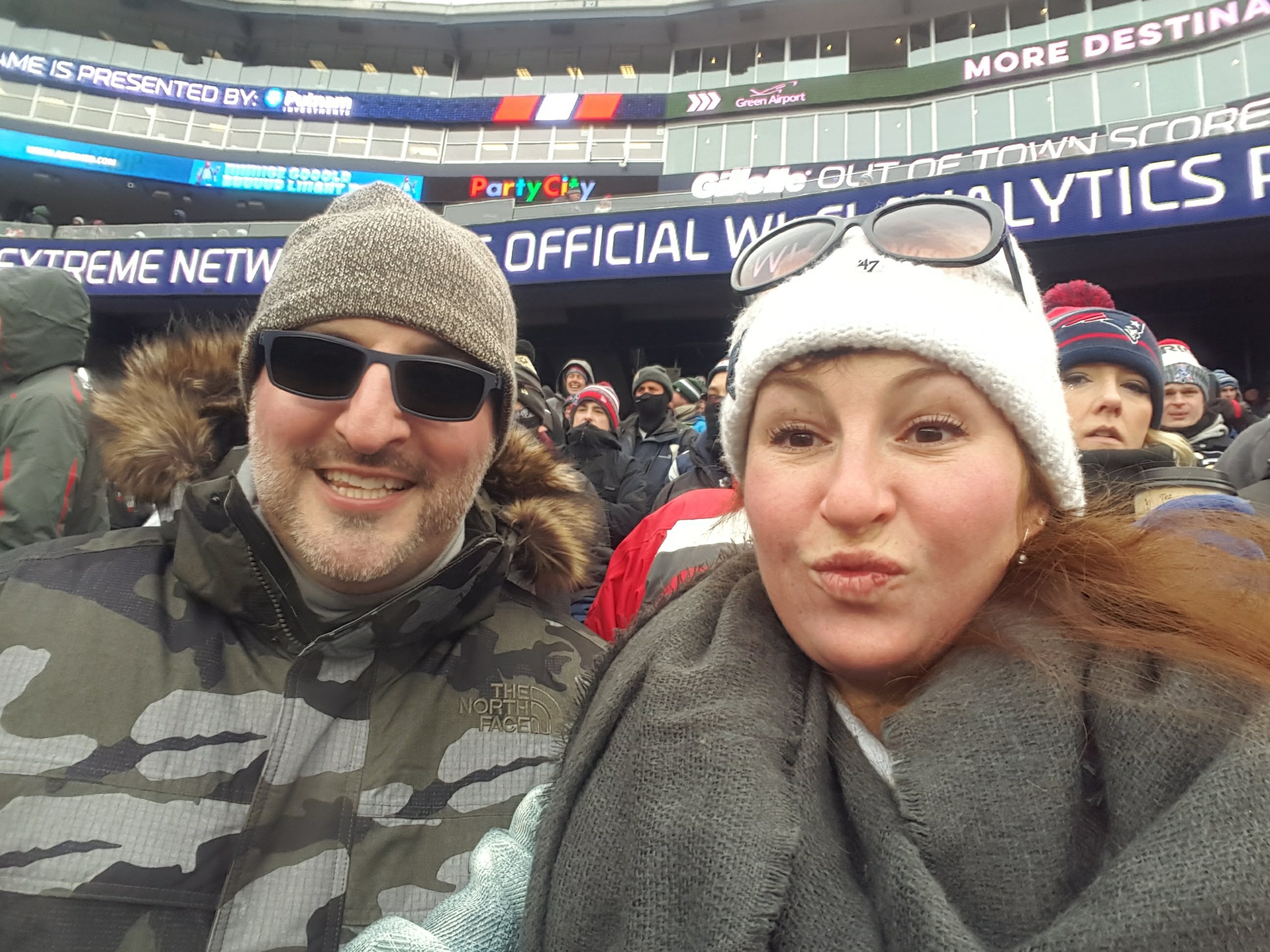 Jami and Christian together at a football game