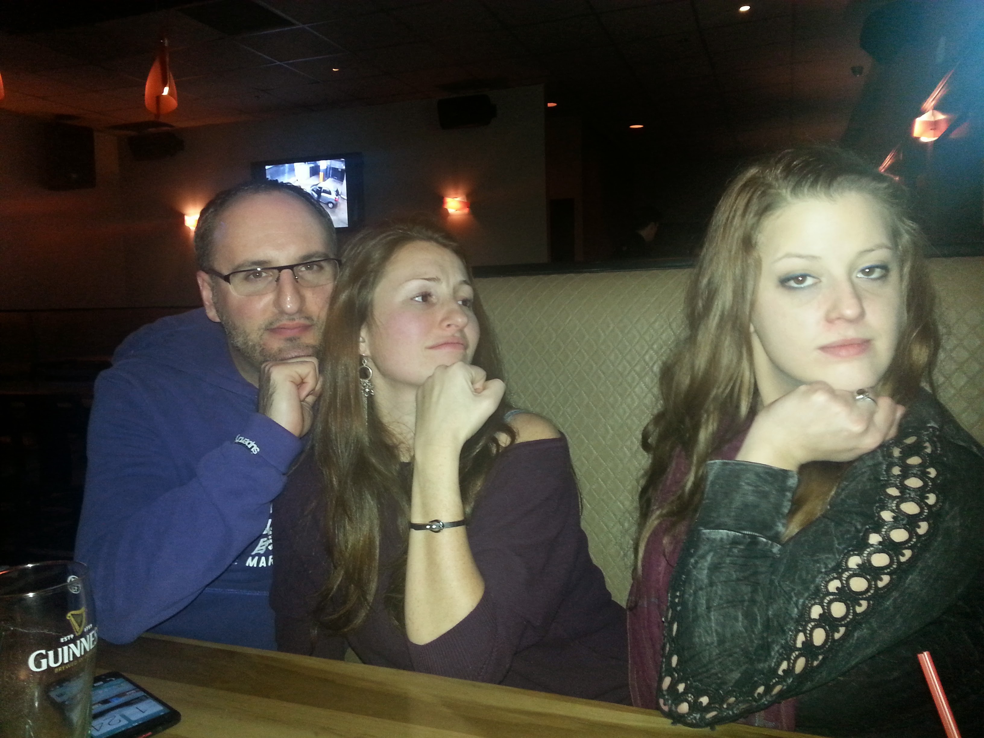 Jami, Christian, and a friend posing together on a night out