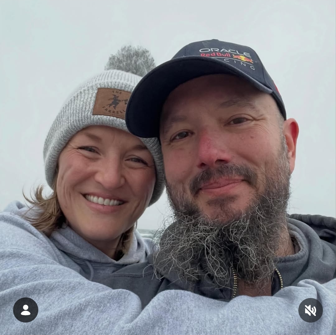 Jami and Craig smiling together outdoors