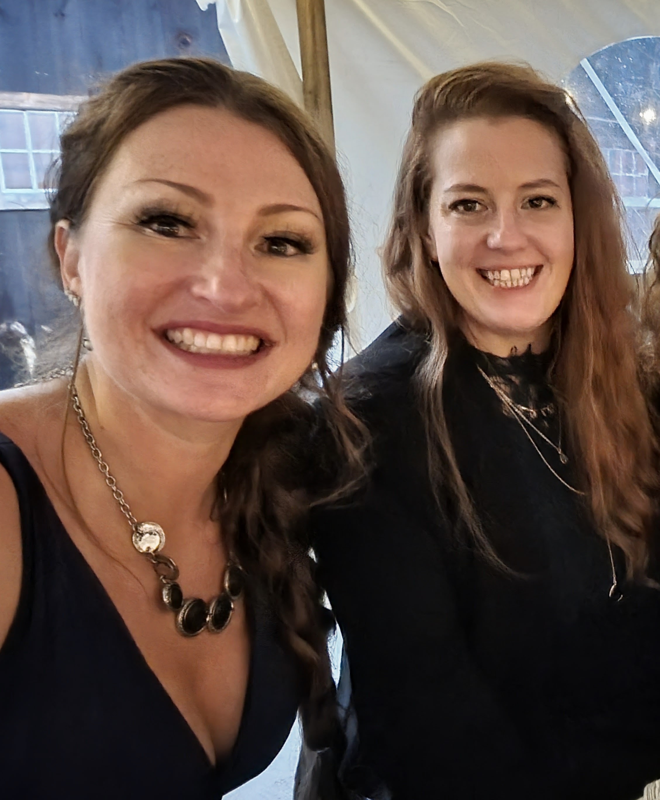 Kristy and Jami dressed up and smiling together