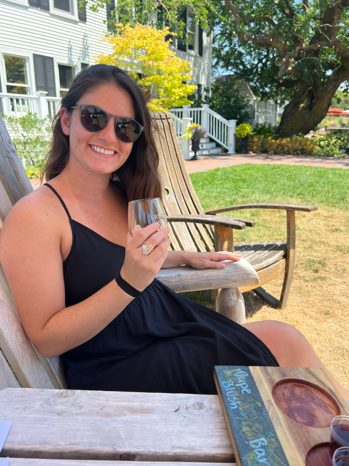 Melinda enjoying a glass of wine outdoors