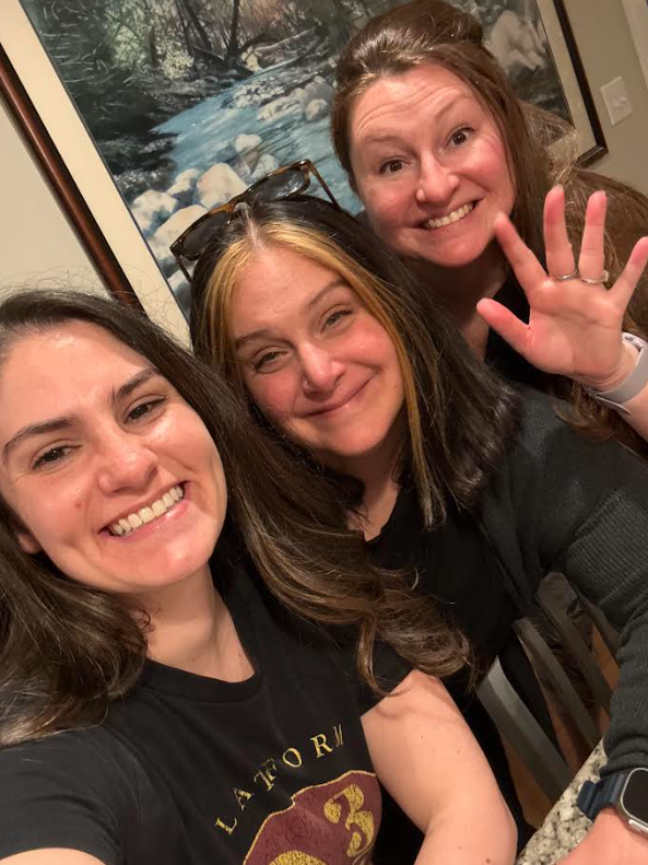Jami, Melinda, and a friend smiling together